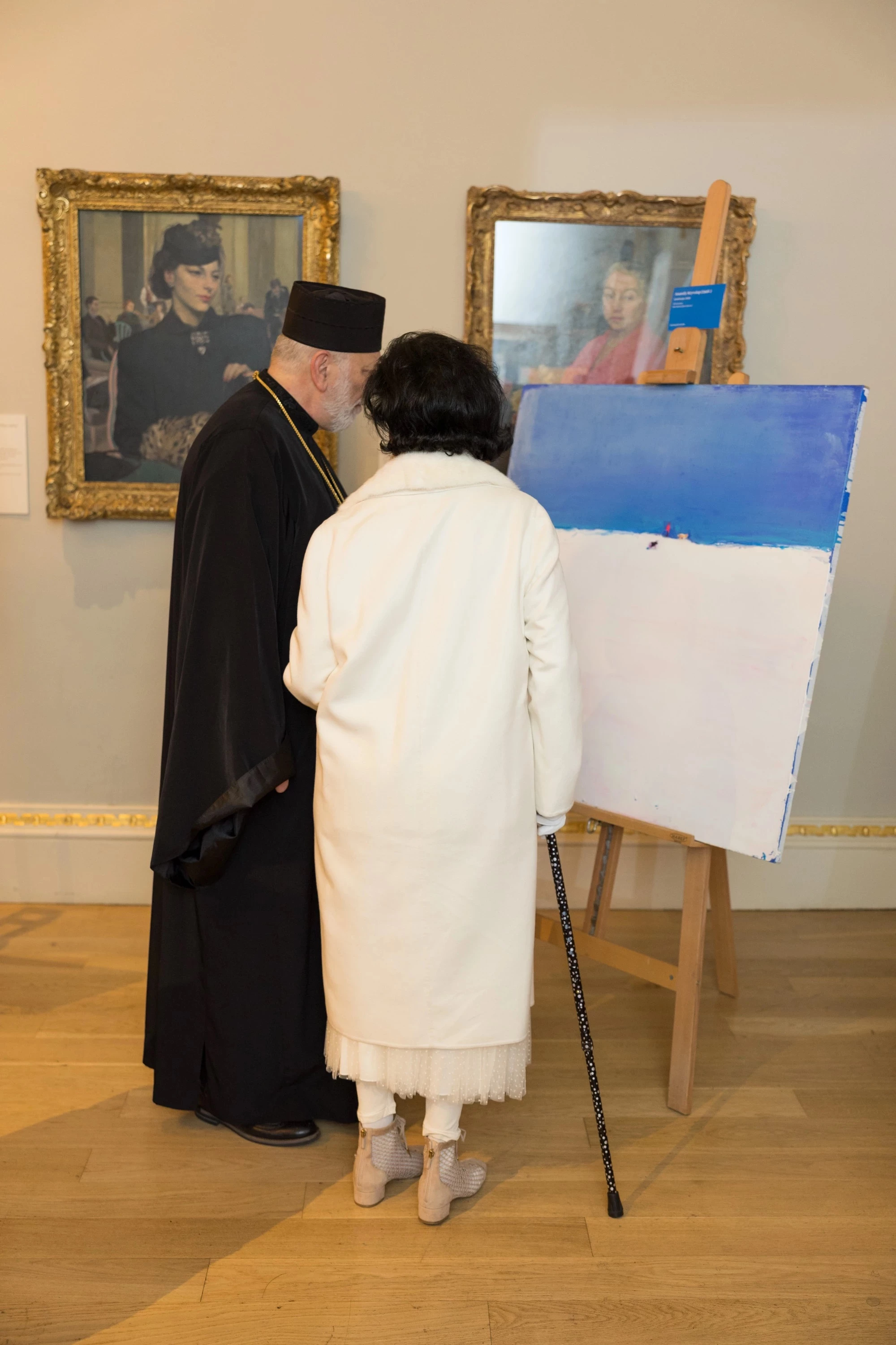 The Bishop of the Ukrainian Catholic Diocese of the Holy Family with a seat in London, Kenneth Nowakovsky and Bianca Jagger. Auction at the Royal Academy of Arts, London (Photo by Marcus Dawes)