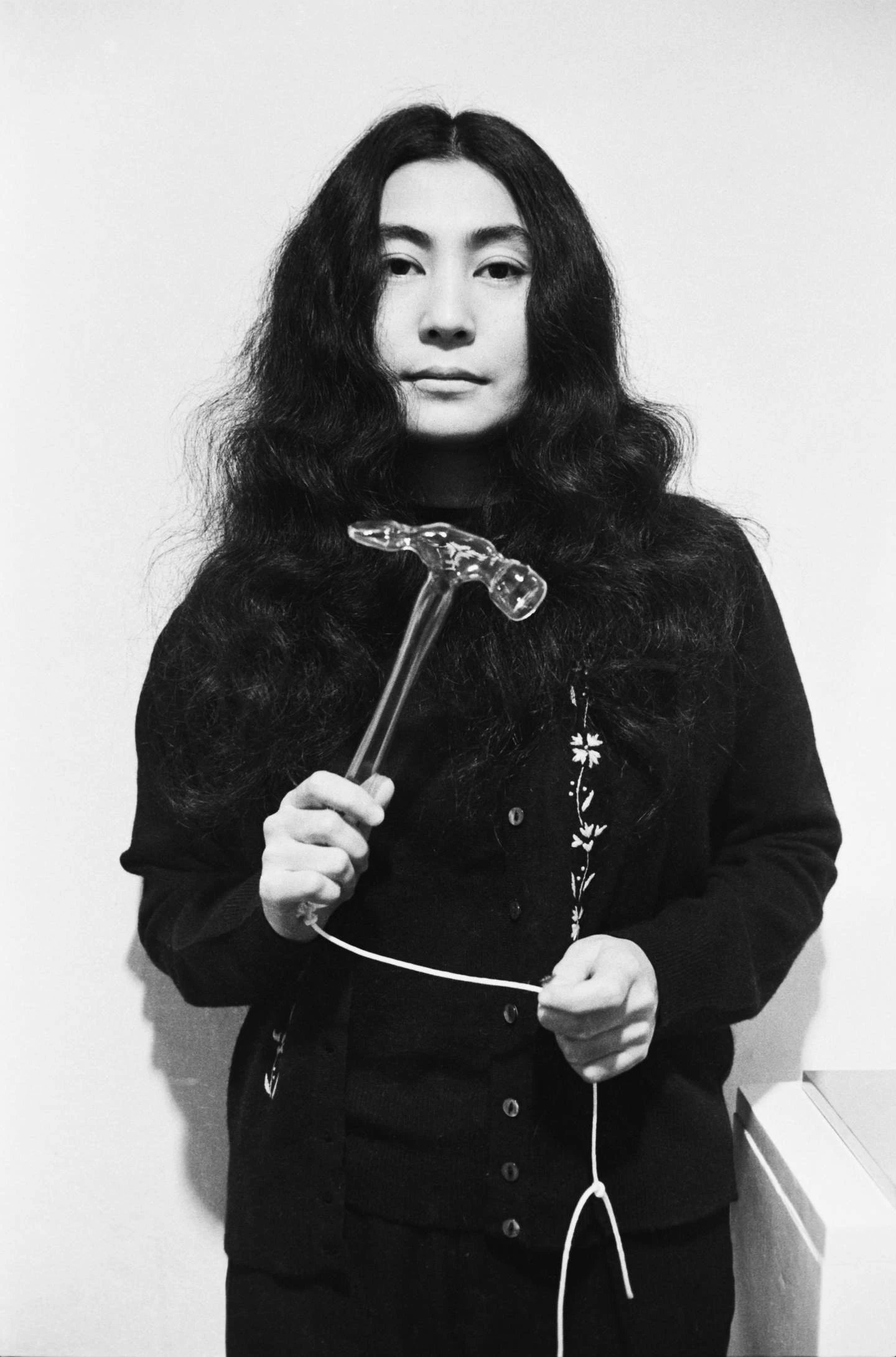 Yoko Ono with Glass Hammer 1967 from HALF-A-WIND SHOW, Lisson Gallery, London, 1967. Photograph: Clay Perry © Yoko Ono